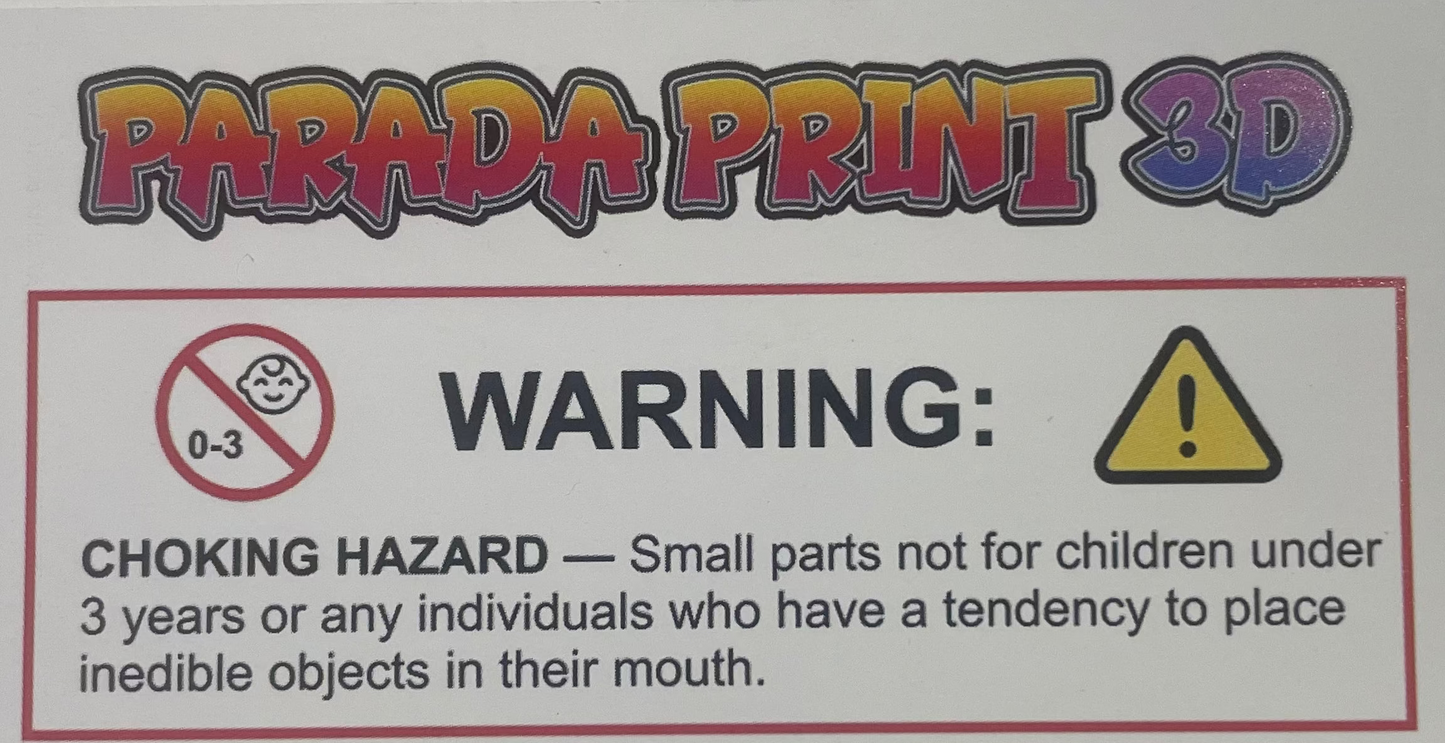 A close-up of a white product label or packaging insert featuring a choking hazard warning, a yellow caution icon, and vertical 'PARADA PRINT 3D' branding in a multicolor gradient.